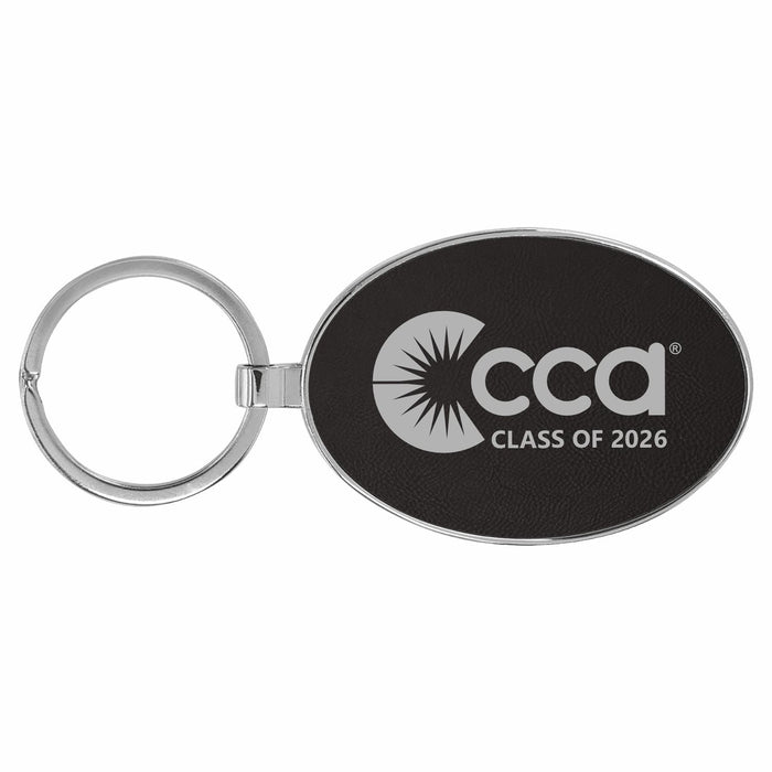 Black oval keychain with 'CCA Class of 2026' engraved text on a white background