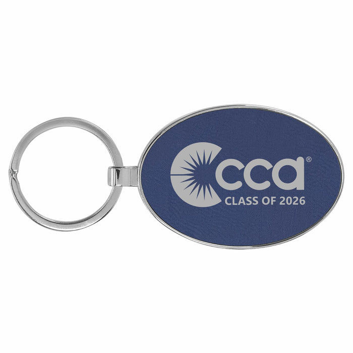 Blue oval keychain with 'CCA Class of 2026' engraved text on a white background
